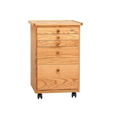 A BEST Studio Taboret 5 Drawer by BEST on wheels with five drawers, featuring easy-glide plastic casters. The top four drawers are smaller, while the bottom drawer is larger, each with a round wooden knob. The cabinet offers a solid flat top surface for added utility.