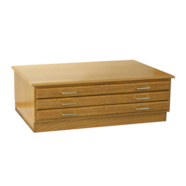 A rectangular, wooden chest of drawers with a light finish. It has three horizontal drawers, each with a slim, metallic handle. This Best Oak Flat File by BEST design is simple and modern, perfect for artist paper storage with its flat top surface and clean lines.