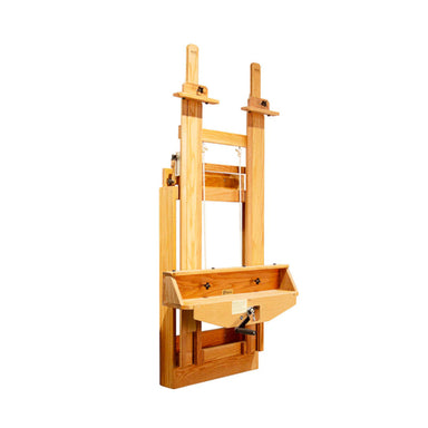 The BEST Wall Mount Easel by BEST is perfect for a professional artist's studio space. It has adjustable vertical supports and a ledge for art supplies. The design allows for height adjustment and stability, making it suitable for various canvas sizes. The wood has a light finish, showcasing its natural grain.