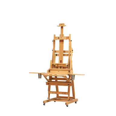 A BEST Full Tilt Manhattan Easel with a sturdy frame and adjustable sliding mast stands against a plain white background. The easel features side shelves, metal cups, and a double fold-out painting tray. Mounted on wheels for easy mobility, it offers both functionality and convenience for any artist.